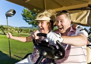 This couple is WAY too happy driving a golf cart